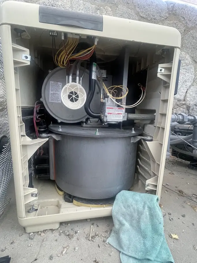 Pool heater opened for inspection and repair